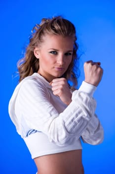 Sporty young woman with fists I