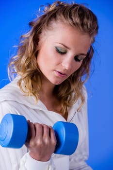 Woman doing dumbbell training II
