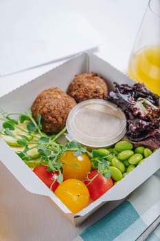 meatballs with beans, herbs, cherry tomatoes and sauce