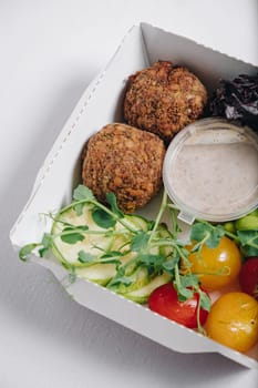 meatballs with beans, herbs, cherry tomatoes and sauce