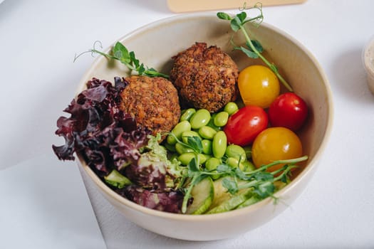 meatballs with beans, herbs, cherry tomatoes and sauce