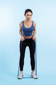 Vigorous energetic woman in sportswear portrait stretching resistance sport band. Young athletic asian woman strength and endurance training session workout routine concept on isolated background.