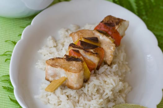 Fish skewers with rice