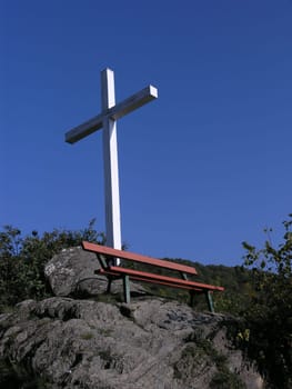 Summit cross and red bench