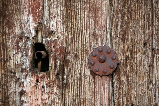 Keyhole in old wooden door