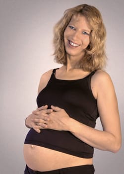 beaming smiling pregnant woman