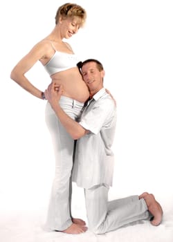 Father-to-be listens to baby