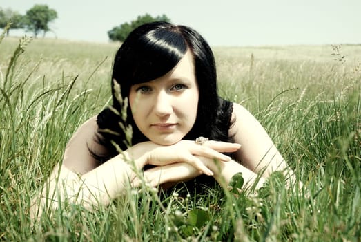 Young woman in the grass