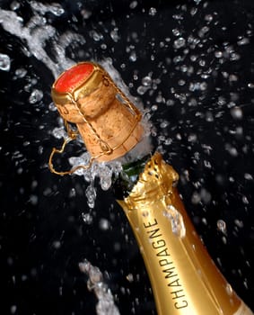 Popping champagne bottle