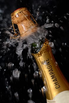 Popping champagne bottle