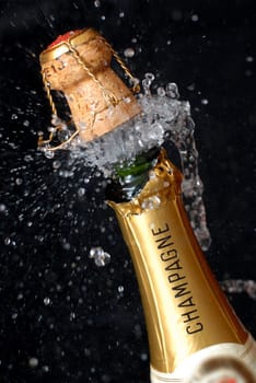 Popping champagne bottle