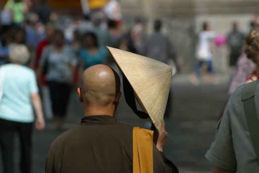 Asian monk with sunscreen