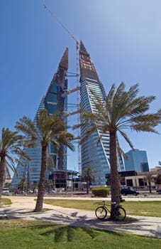 Bike break in the midday heat in front of the new World Trade Centre in Manama/Bahrain.