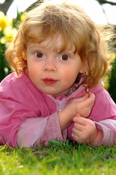 Little girl on spring meadow