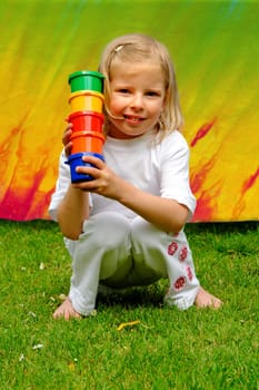 Little girl with paint pots
