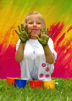Naughty little girl with finger paints