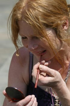 red-haired woman over 40