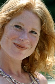 red-haired woman over 40