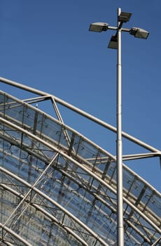 Glass roof construction with street lamp