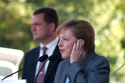 Merkel's hand on the ear