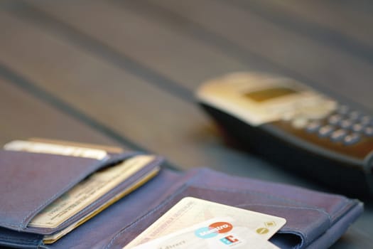 Wallet with telephone and debit card