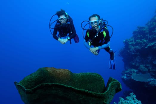 My wife and I on a dive in Sulawesi / Indonesia. The shot was taken with a large fisheye,hence the somewhat plastic effect.