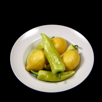 Plate of lemons and green bell pepper