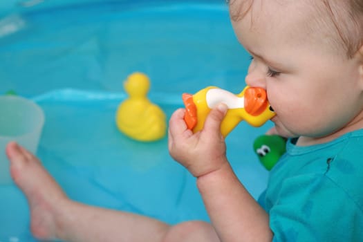 Toddler in paddling pool