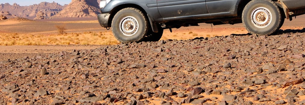 Off-road vehicle in the Stone Desert,Akakus Mountains,Sahara Desert,Libya