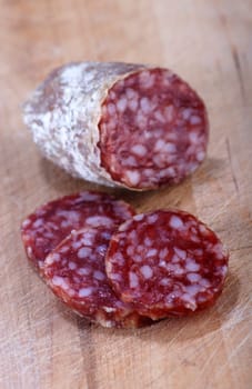 Salami on wooden board