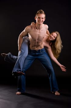 Couple with jeans having fun