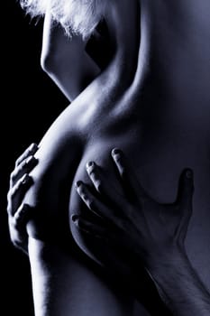 Hands clasp female buttocks