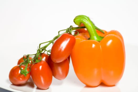 Orange bell pepper with egg tomatoes