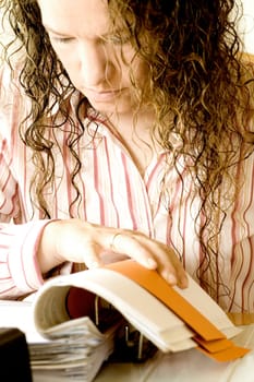 Woman reading in file folder