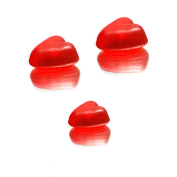 Three wine gum hearts on a mirror