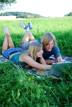Young couple using laptop