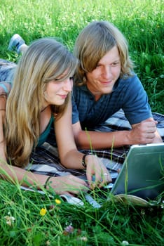 Young couple using laptop