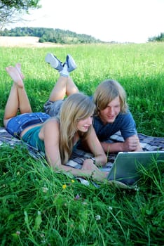 Young couple using laptop