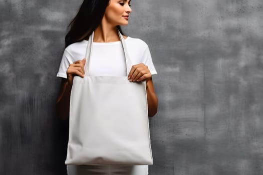 caucasian woman holding blank white tote bag made of canvas fabric with handle her neck, mock up design. Neural network generated in May 2023. Not based on any actual person, scene or pattern.