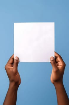 african american hands holding blank sheet of paper on blue background. Neural network generated in May 2023. Not based on any actual person, scene or pattern.
