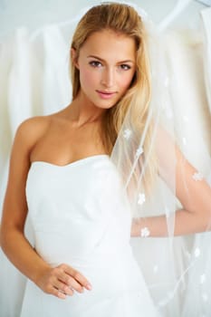 Wedding, portrait and young bride in a dress in a luxury boutique, shop or store in a mall. Retail, romance and female person from Canada preparing for marriage ceremony, party or reception for love