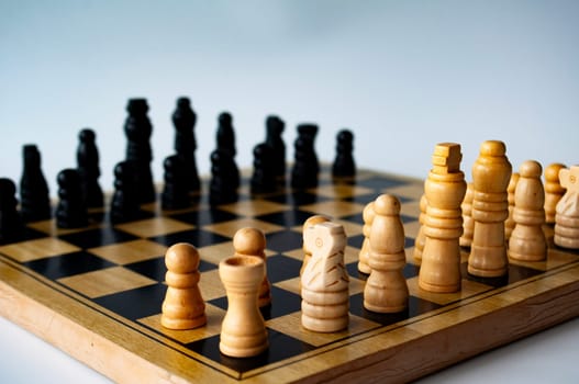 Battle between white and black chess on a chess boar. Strategy and tactics concept.