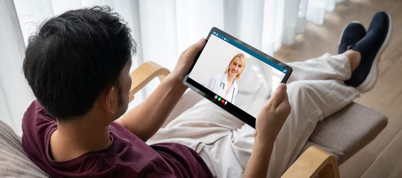 Doctor video call online by modish telemedicine software application for virtual meeting with patient