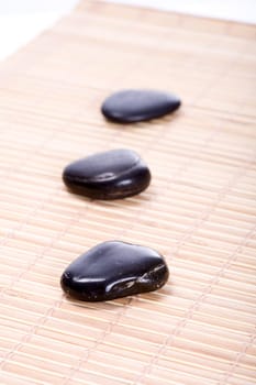 Three Zen Stones on Bamboo Mat