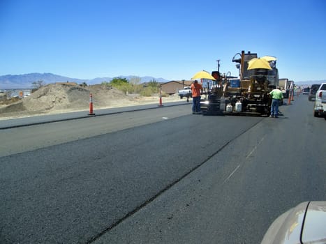 Road construction - tar machine in use