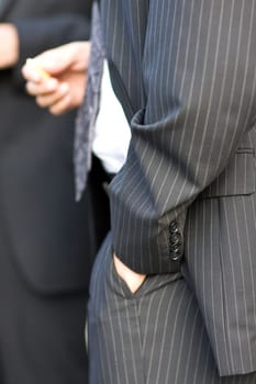 Hand casually in trouser pocket