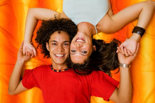 young couple playing on the bed