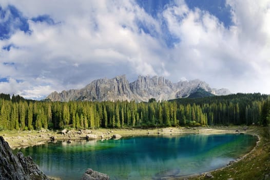 Lake Carezza is located at the foot of the Latemar in South Tyrol. The last light of the day created a breathtaking atmosphere.The picture was taken from 7 portrait format images and is composed with PtGui.