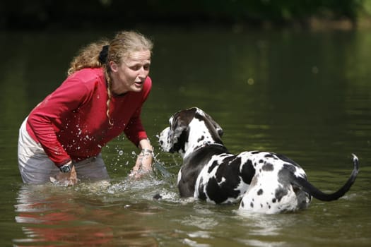 Woman with dog in water