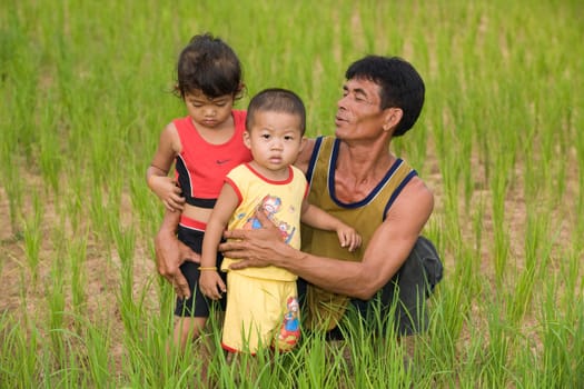 Family in rice field